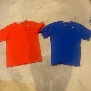 2 blue and red nike dri fit t shirts